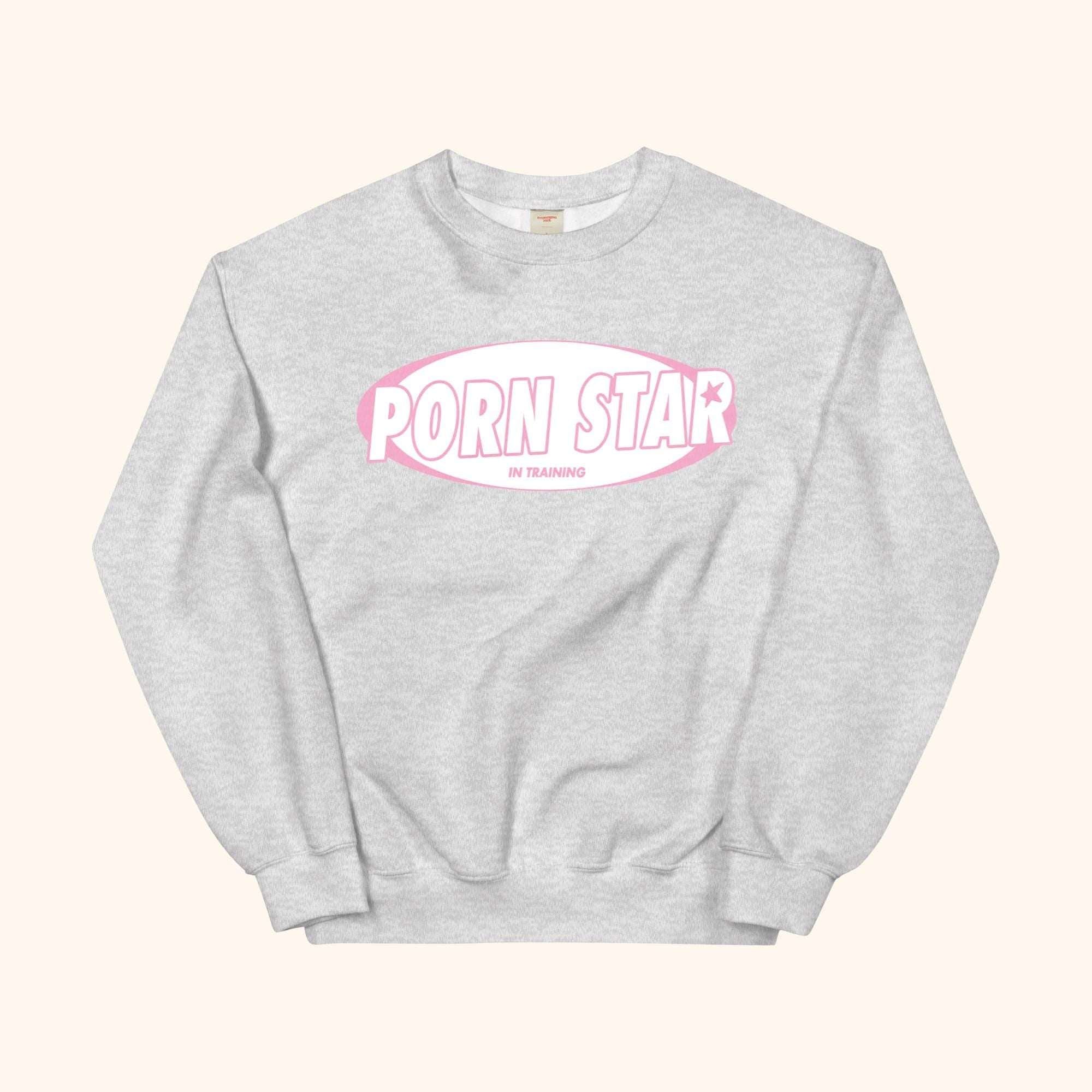 Gray sweatshirt with “PORN STAR” oval graphic on the chest