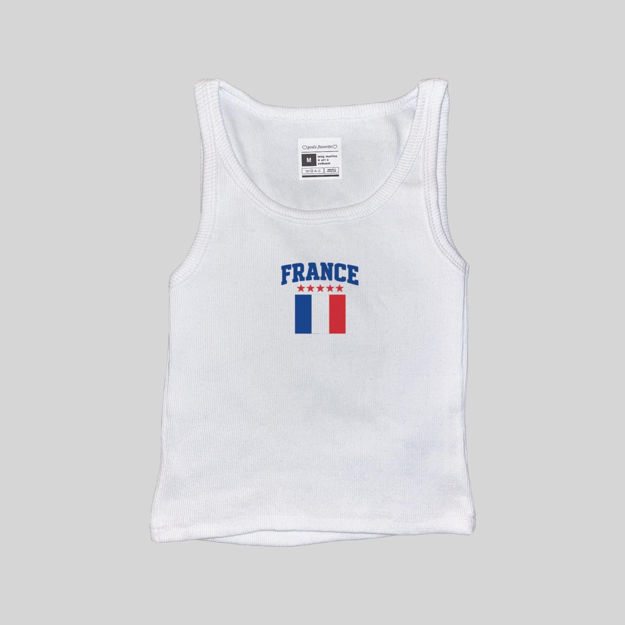 White ribbed muscle tank with centered “FRANCE” and tricolor flag print