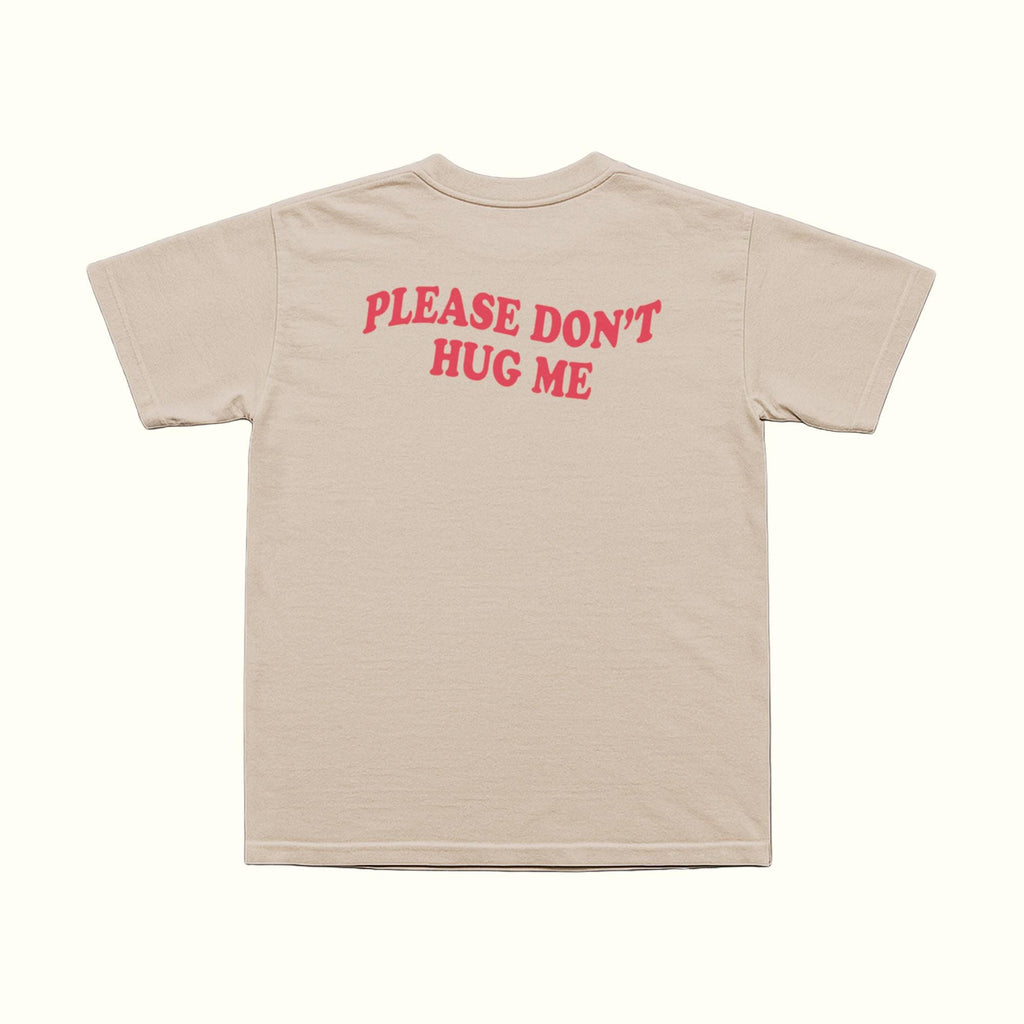 Beige T-shirt back with red 'PLEASE DON'T HUG ME' text