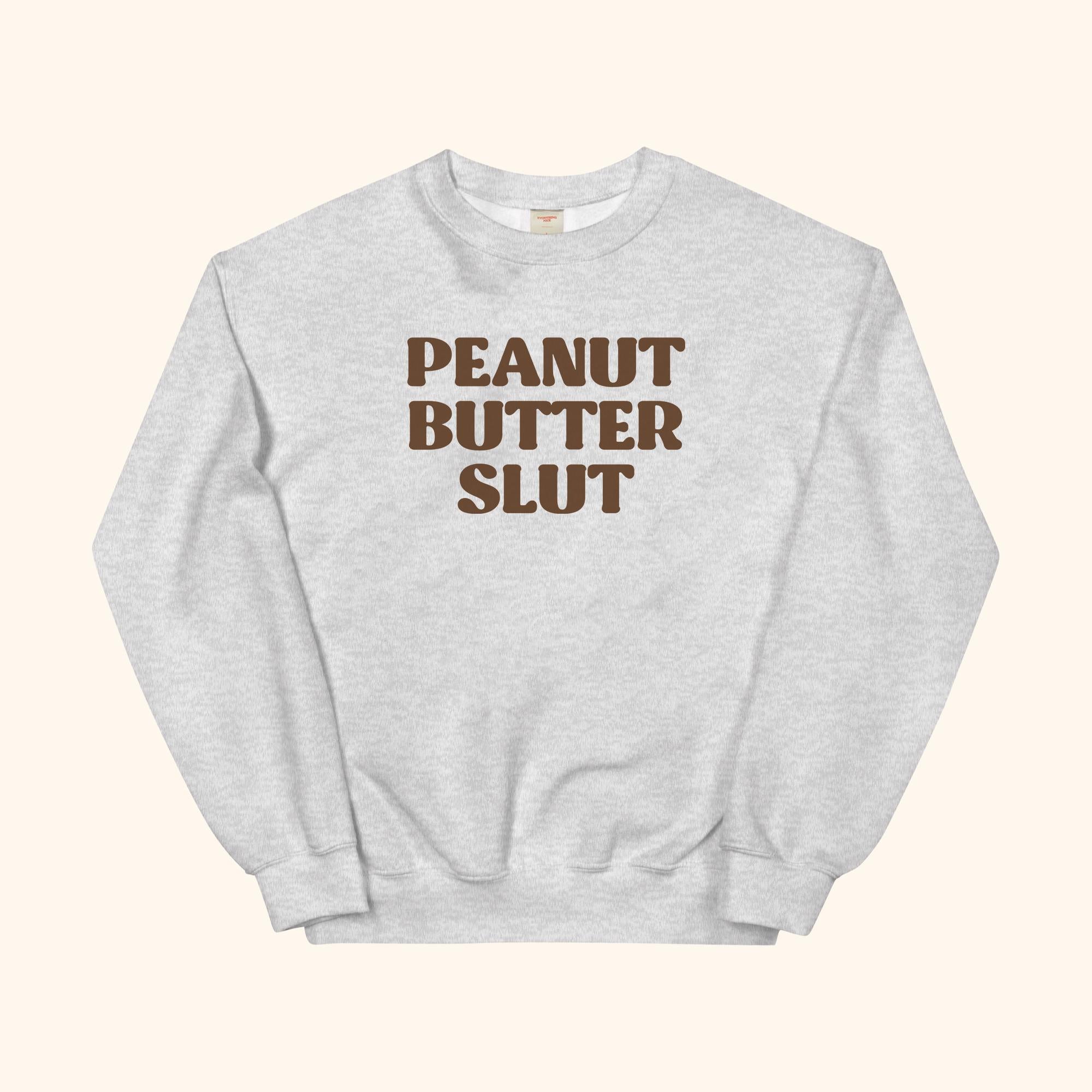 Peanut Butter Slut sweatshirt, gray crewneck with large front graphic text