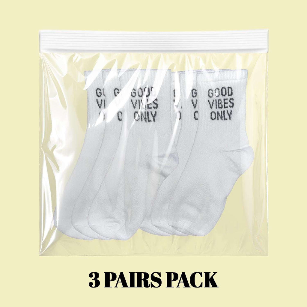 White socks 3-pack in clear plastic bag, 'GOOD VIBES ONLY' on cuffs