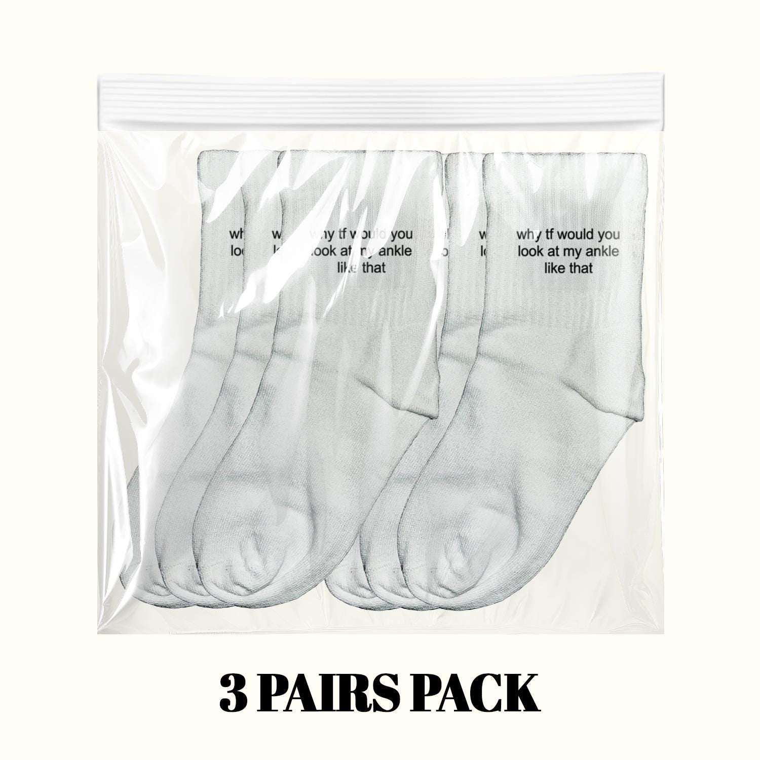 3-pack of light gray ankle socks, stacked in clear pack with slogan text