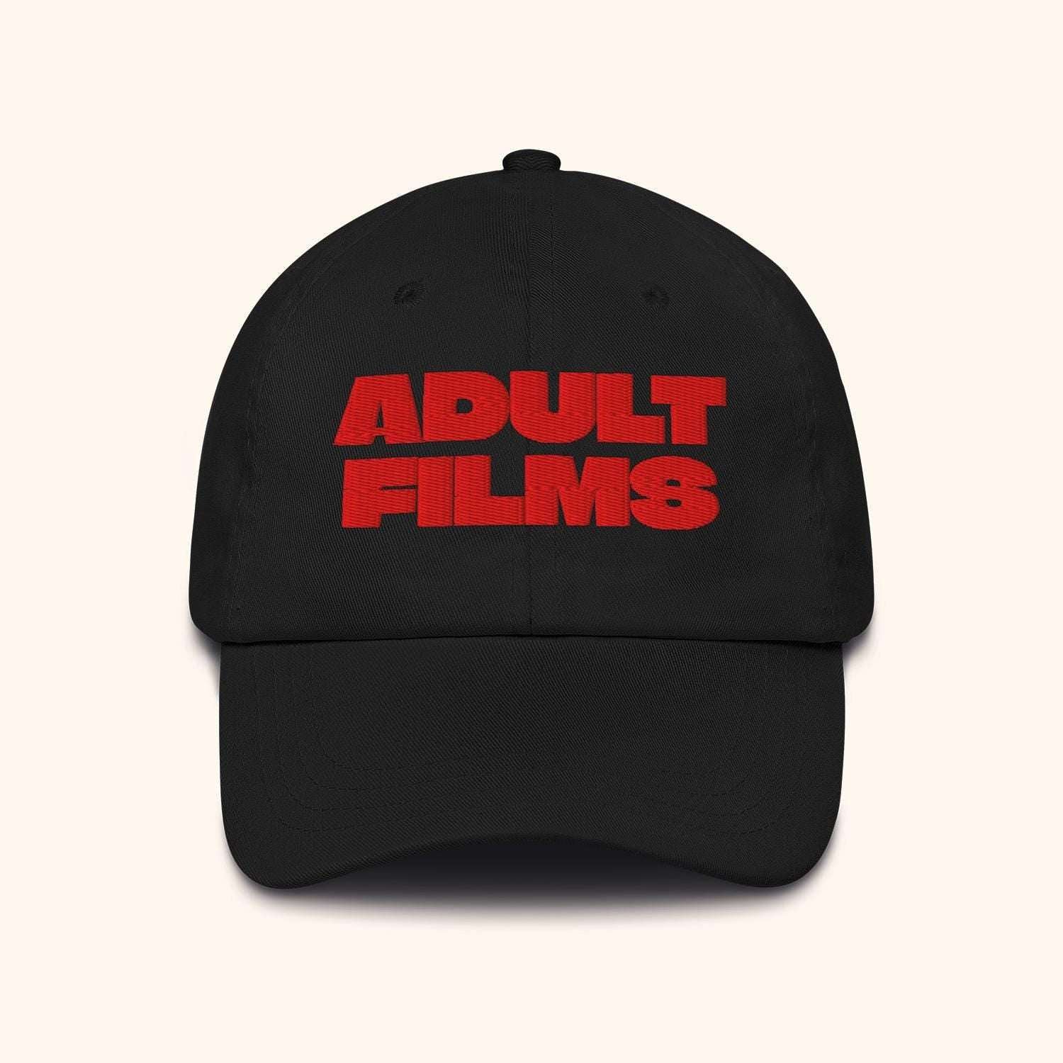 Black baseball cap with red ADULT FILMS logo on front