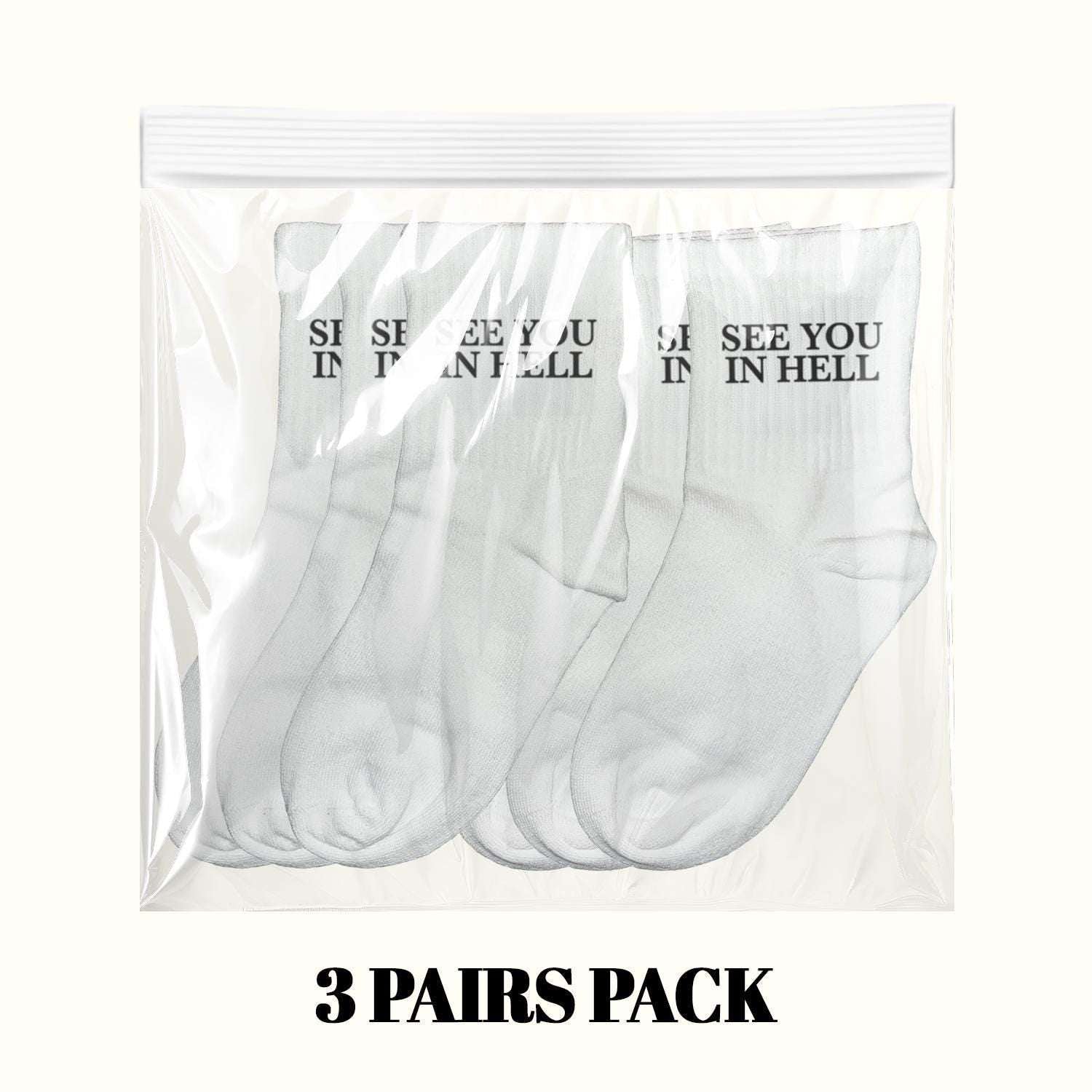 3 pairs pack of white crew socks with “SEE YOU IN HELL” lettering on cuffs.