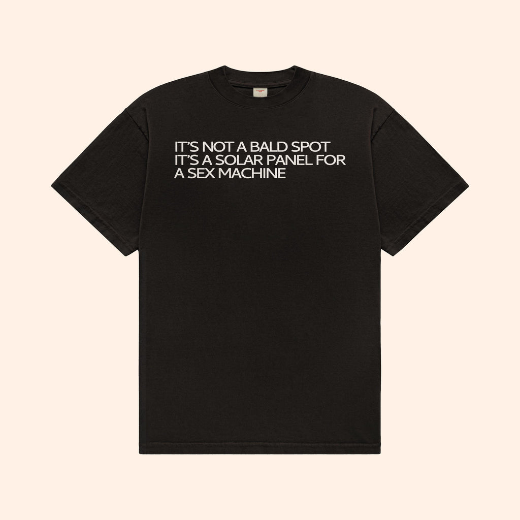 Black T-shirt with front slogan: "IT’S NOT A BALD SPOT" and "SOLAR PANEL"