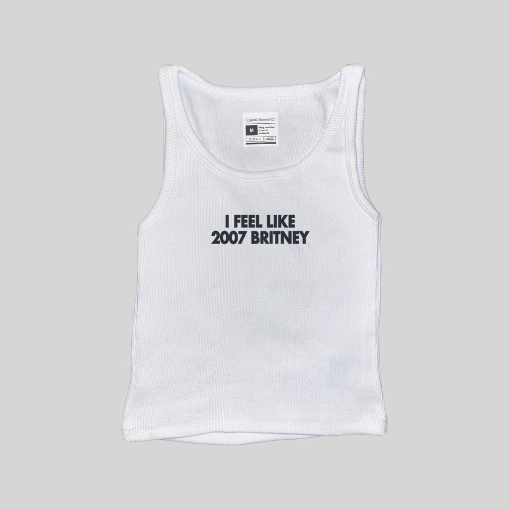 White ribbed muscle tank top with “I FEEL LIKE 2007 BRITNEY” front print, size tag