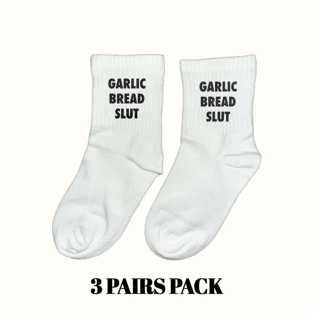 White crew socks with black "GARLIC BREAD SLUT" lettering, ankle length
