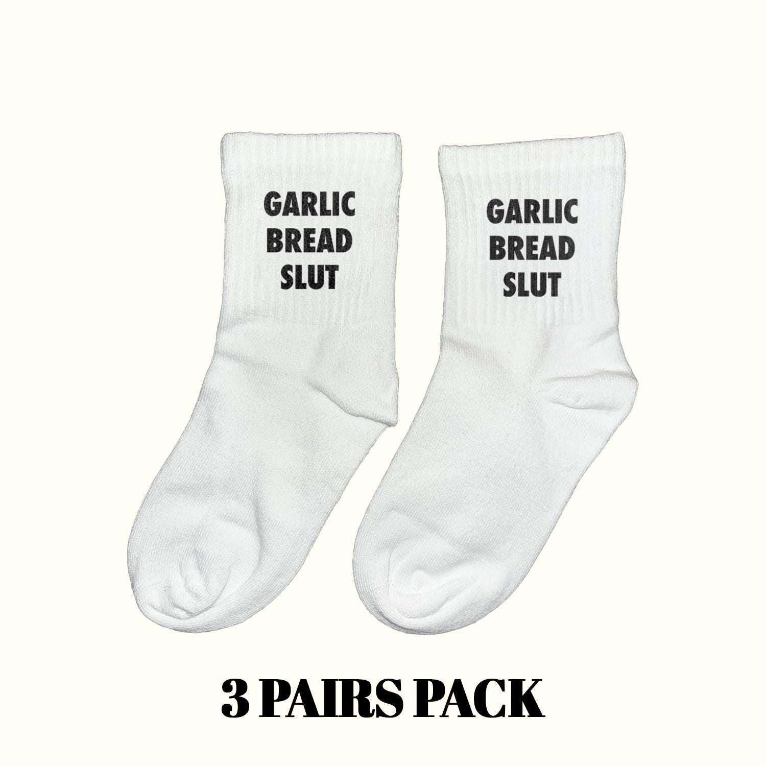 White crew socks with black "GARLIC BREAD SLUT" lettering, ankle length