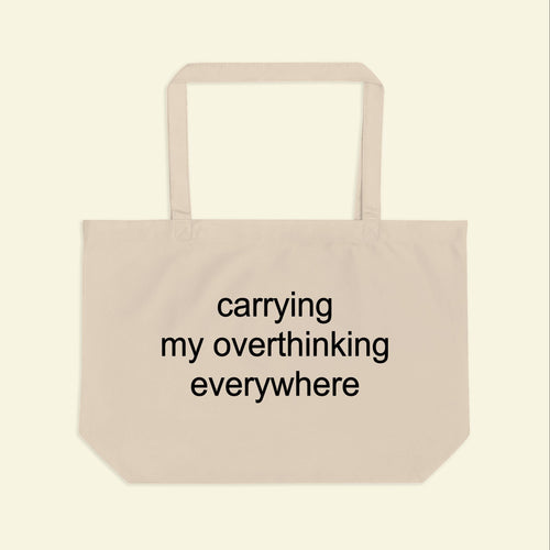 Beige tote bag front panel with slogan 'carrying my overthinking everywhere'