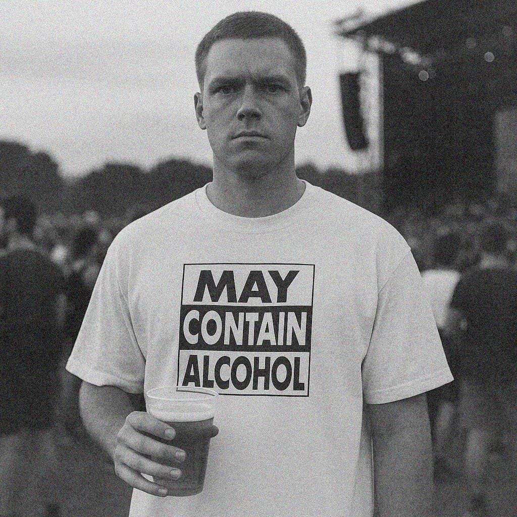White unisex T-shirt with bold “MAY CONTAIN ALCOHOL” front graphic