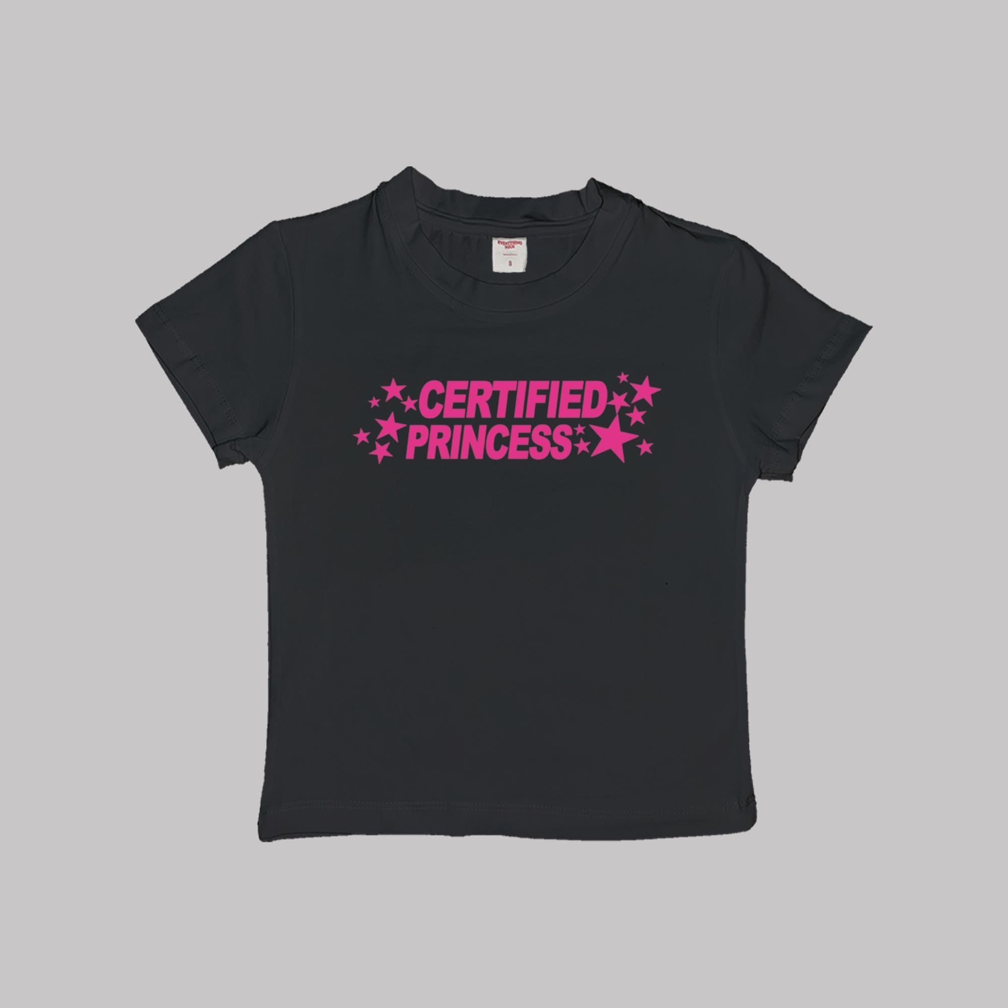 Black short-sleeve crop baby tee with pink 'CERTIFIED PRINCESS' star lettering.