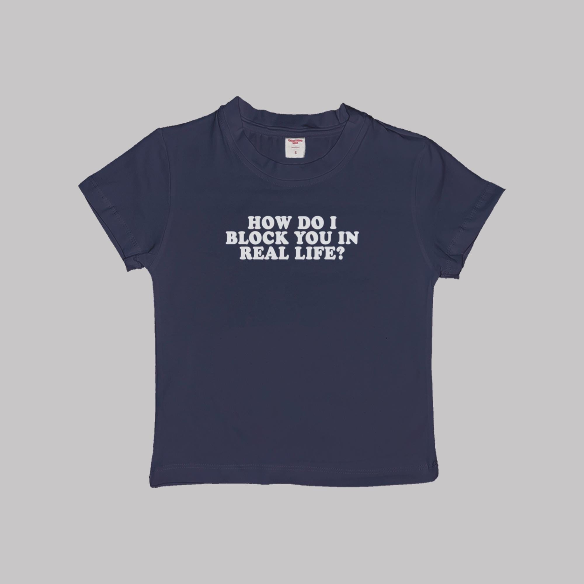 Navy crop baby tee with 'HOW DO I BLOCK YOU IN REAL LIFE?' white graphic.
