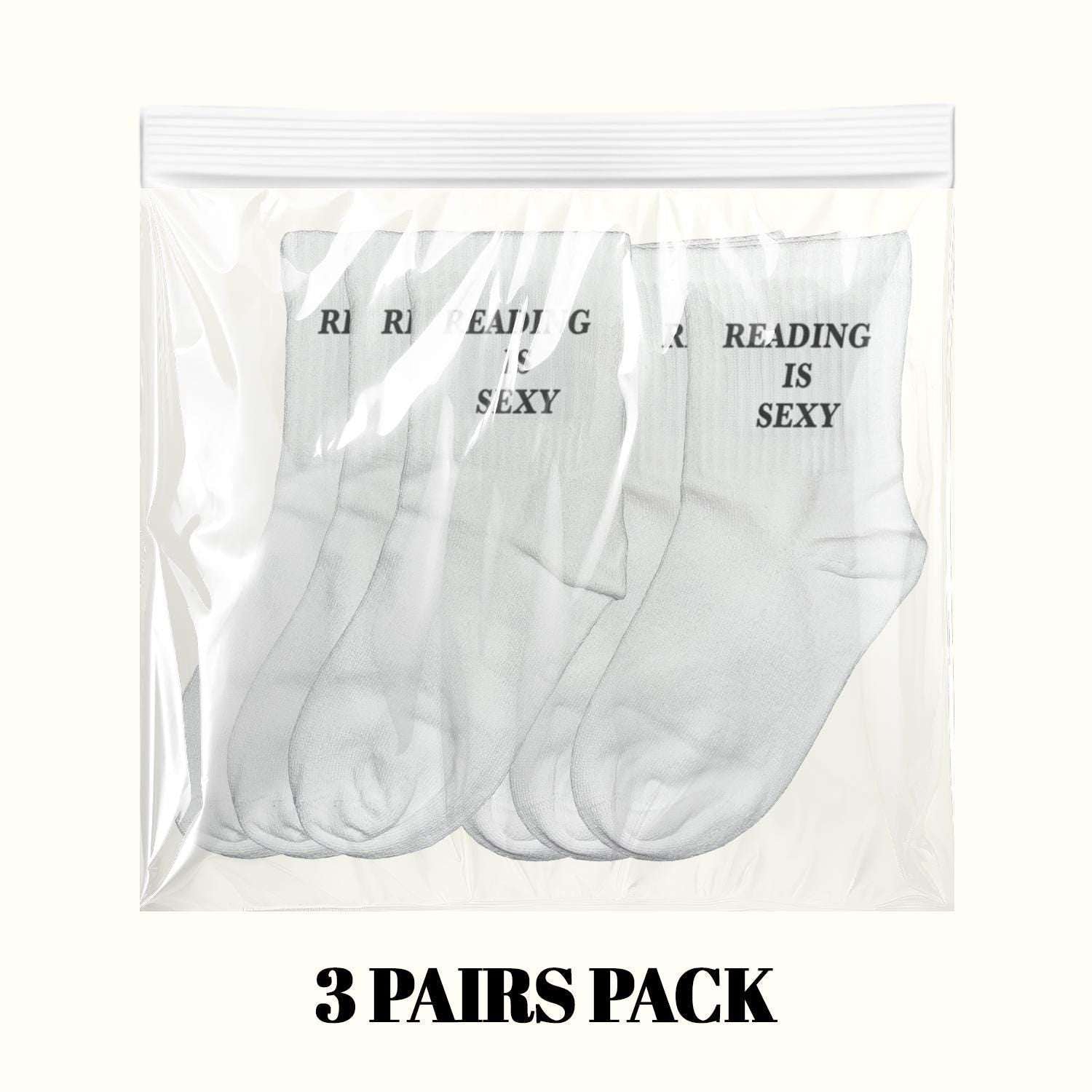 3 pairs pack of white crew socks with “READING IS SEXY” text
