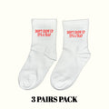 Crew socks, white with red 'DON'T GROW UP IT'S A TRAP' lettering