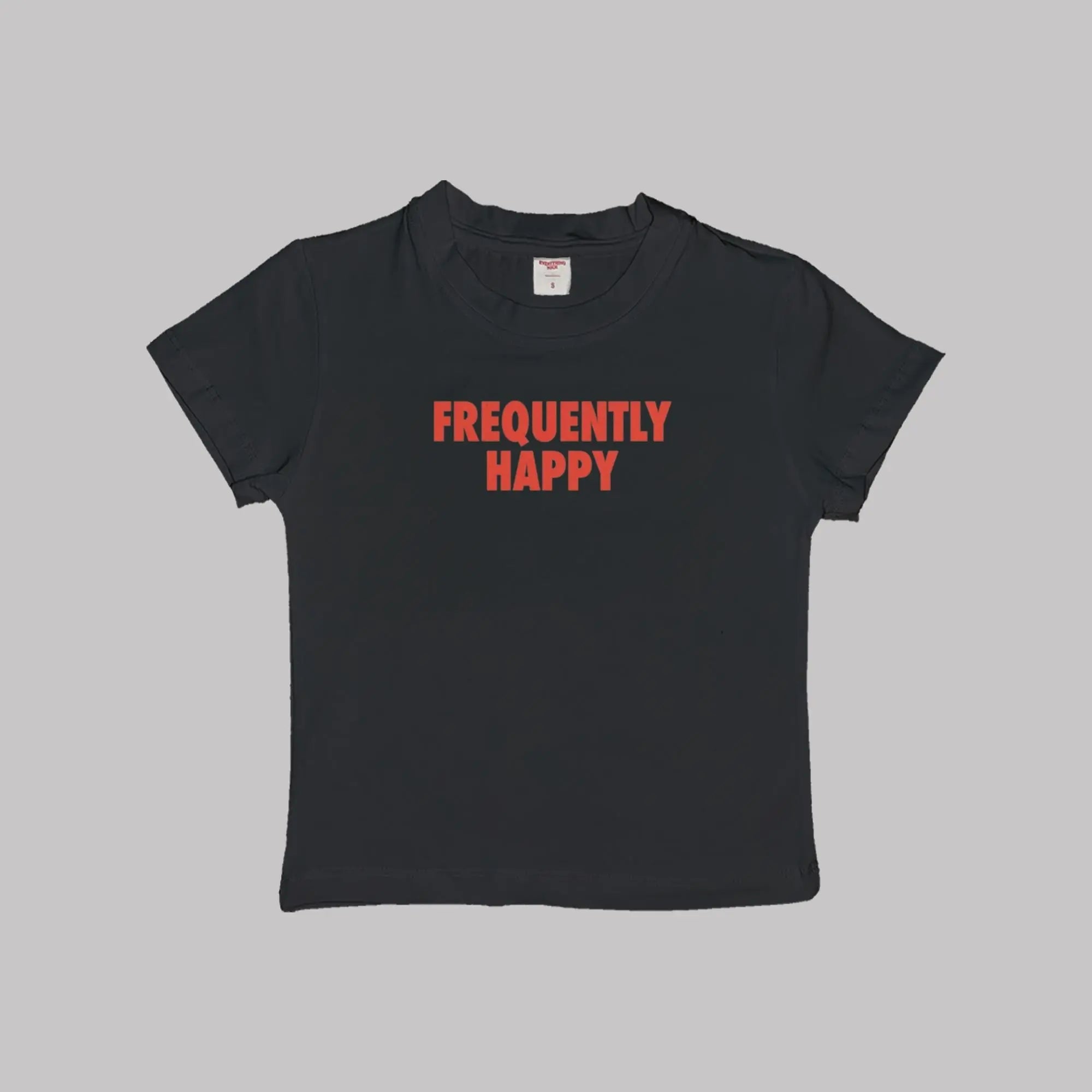 Black crop baby tee with crew neck and red “FREQUENTLY HAPPY” graphic