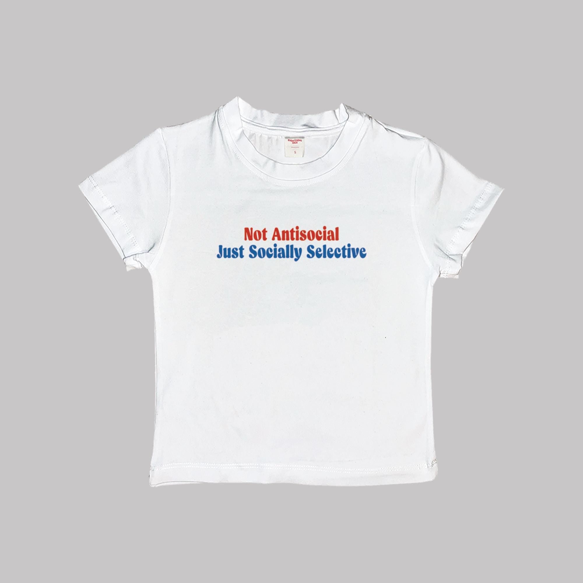 White short-sleeve baby tee, front graphic: 'Not Antisocial, Just Socially Selective'