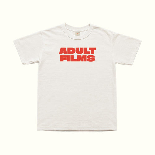 White Adult Films T-Shirt, crew neck, red “ADULT FILMS” text print on front.