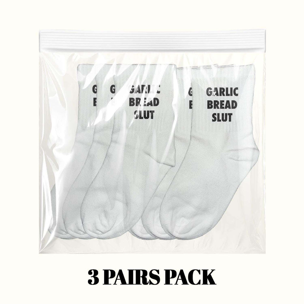 Three-pair pack of white crew socks with black "GARLIC BREAD SLUT" lettering