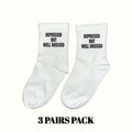 White crew socks with black 'DEPRESSED BUT WELL DRESSED' text, 3-pack