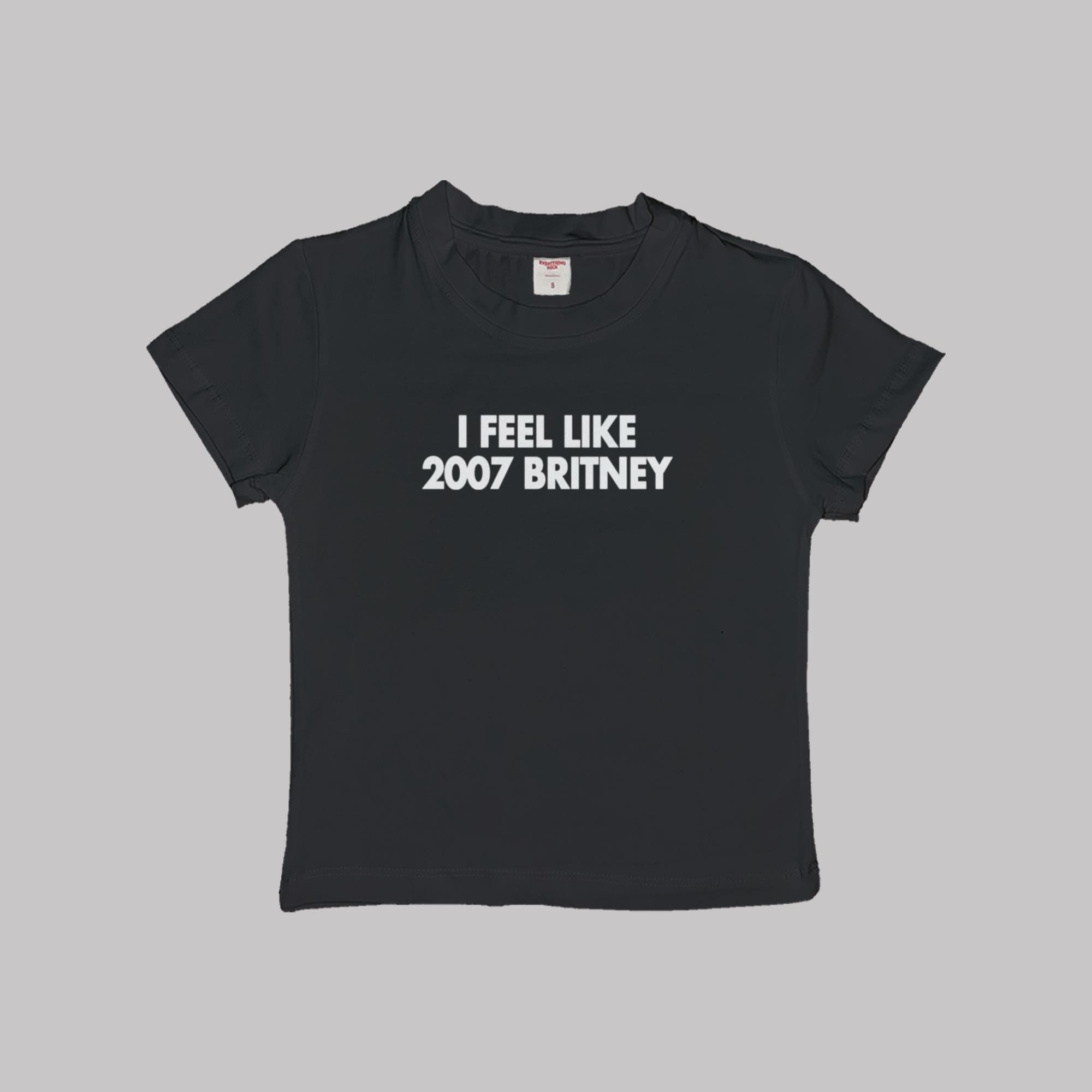Black crop baby T-shirt with “I FEEL LIKE 2007 BRITNEY” front print.