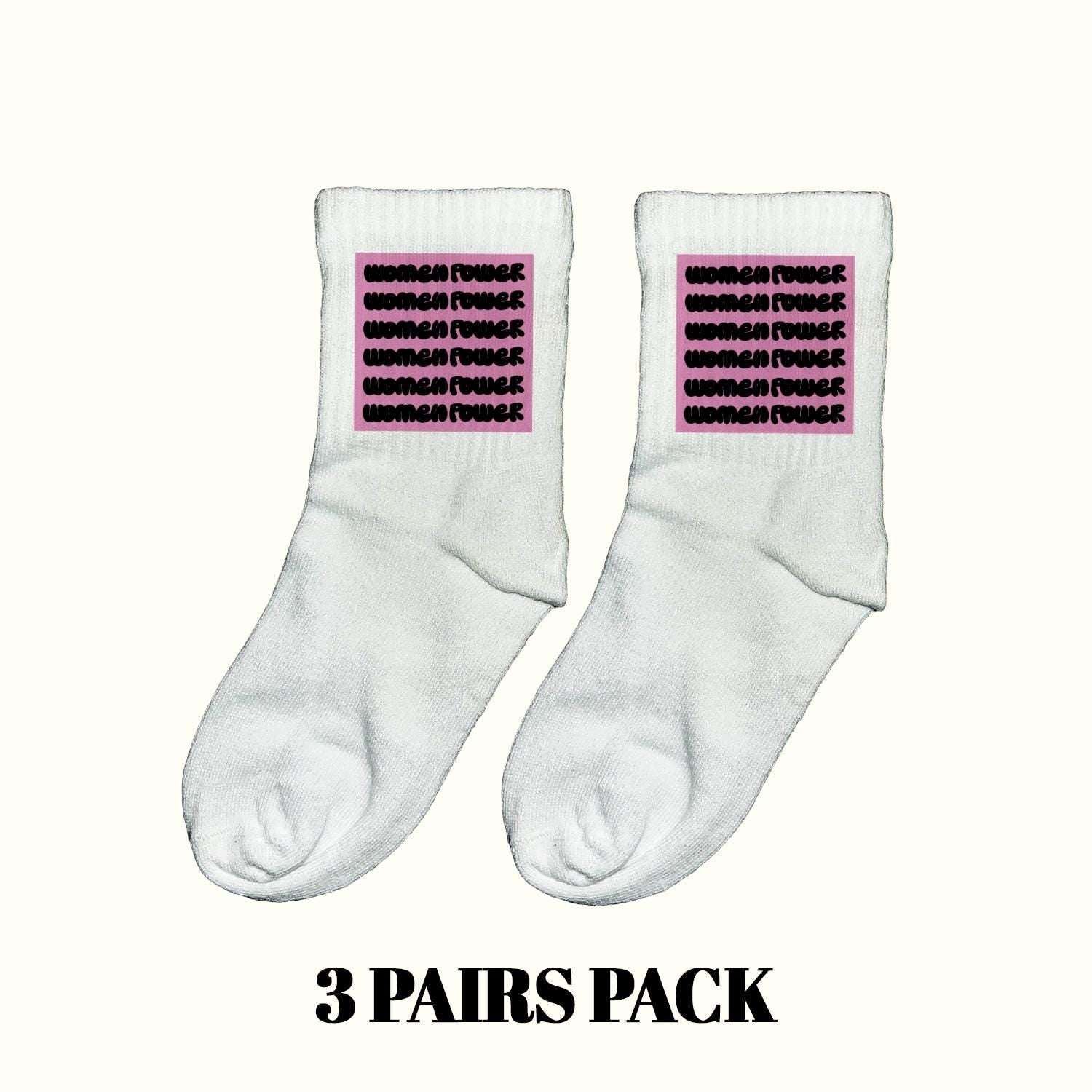 White crew socks with purple empowerment text, cushioned heel and toe