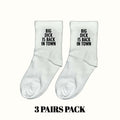 White crew socks with black slogan "BIG DICK IS BACK IN TOWN"