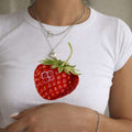 White baby crop T-shirt with strawberry fruit graphic on front