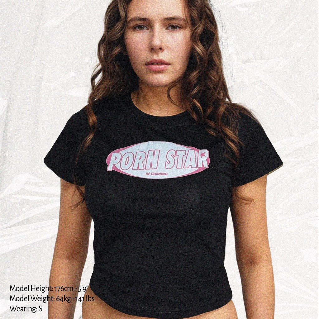 Black baby tee crop top with star training logo graphic, crew neckline