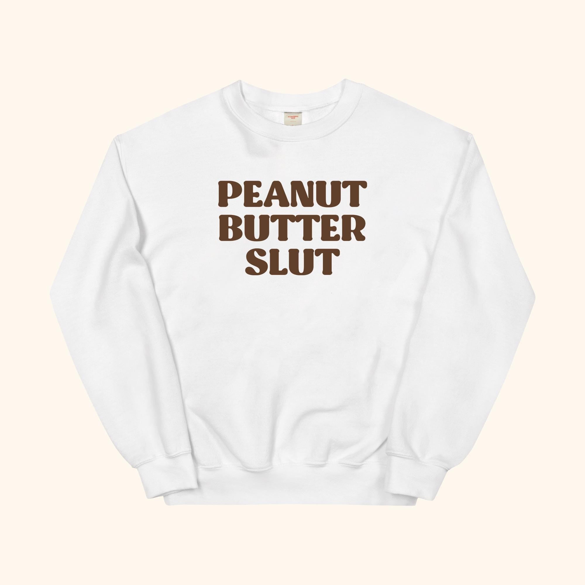 Peanut Butter Slut sweatshirt, white crewneck with large front text logo