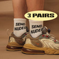 White crew socks with 'SEND NUDES' lettering