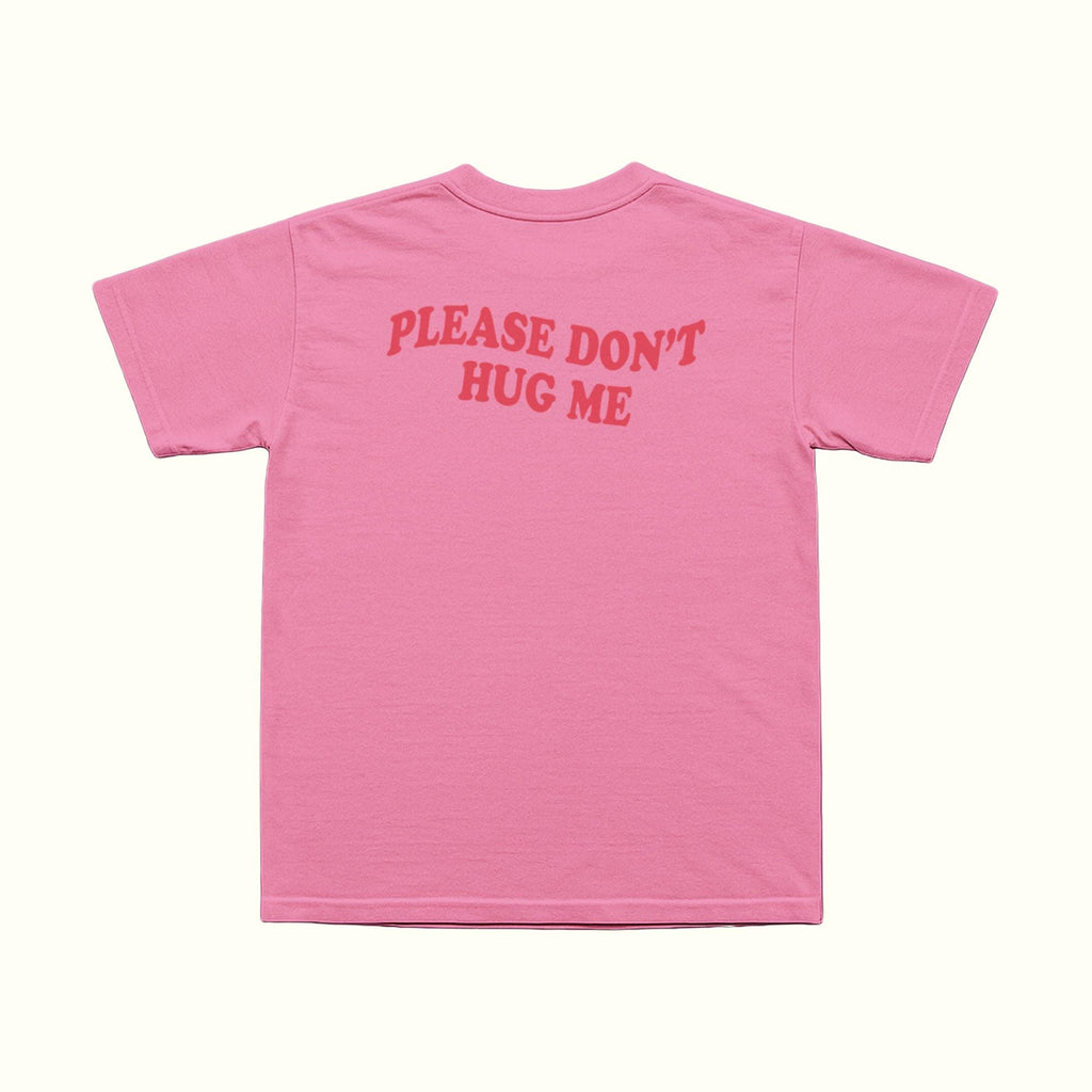 Pink T-shirt back with red 'PLEASE DON'T HUG ME' text