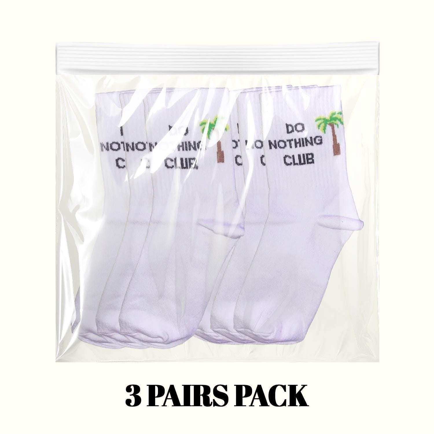 White crew socks 3-pair pack with do nothing club text and palm tree graphic