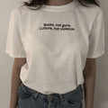 White graphic T-shirt with 'Books, not guns. Culture, not violence.' chest text