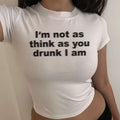 White baby tee with large black quote graphic on front