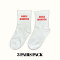 Ankle monitor socks, white crew with red 'ANKLE MONITOR' text