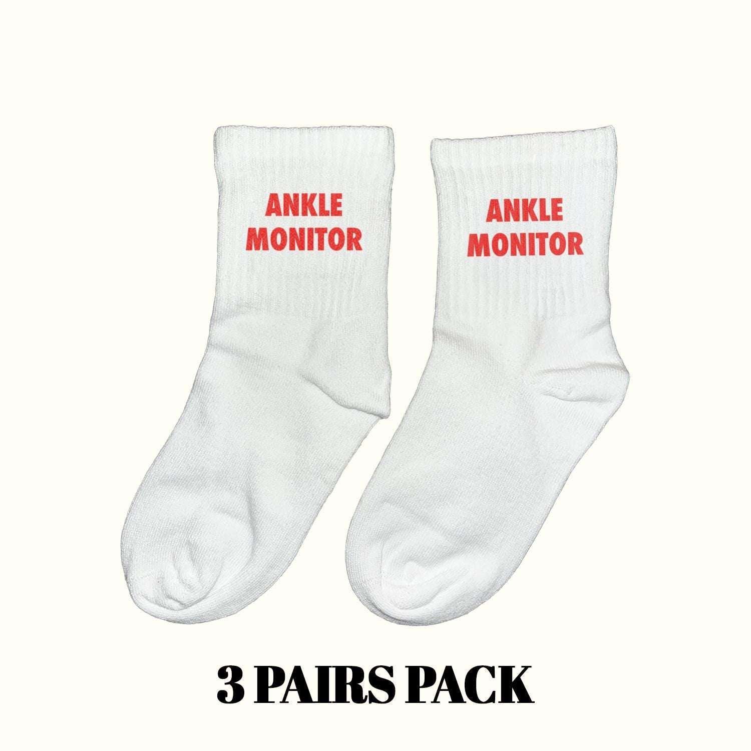Ankle monitor socks, white crew with red 'ANKLE MONITOR' text