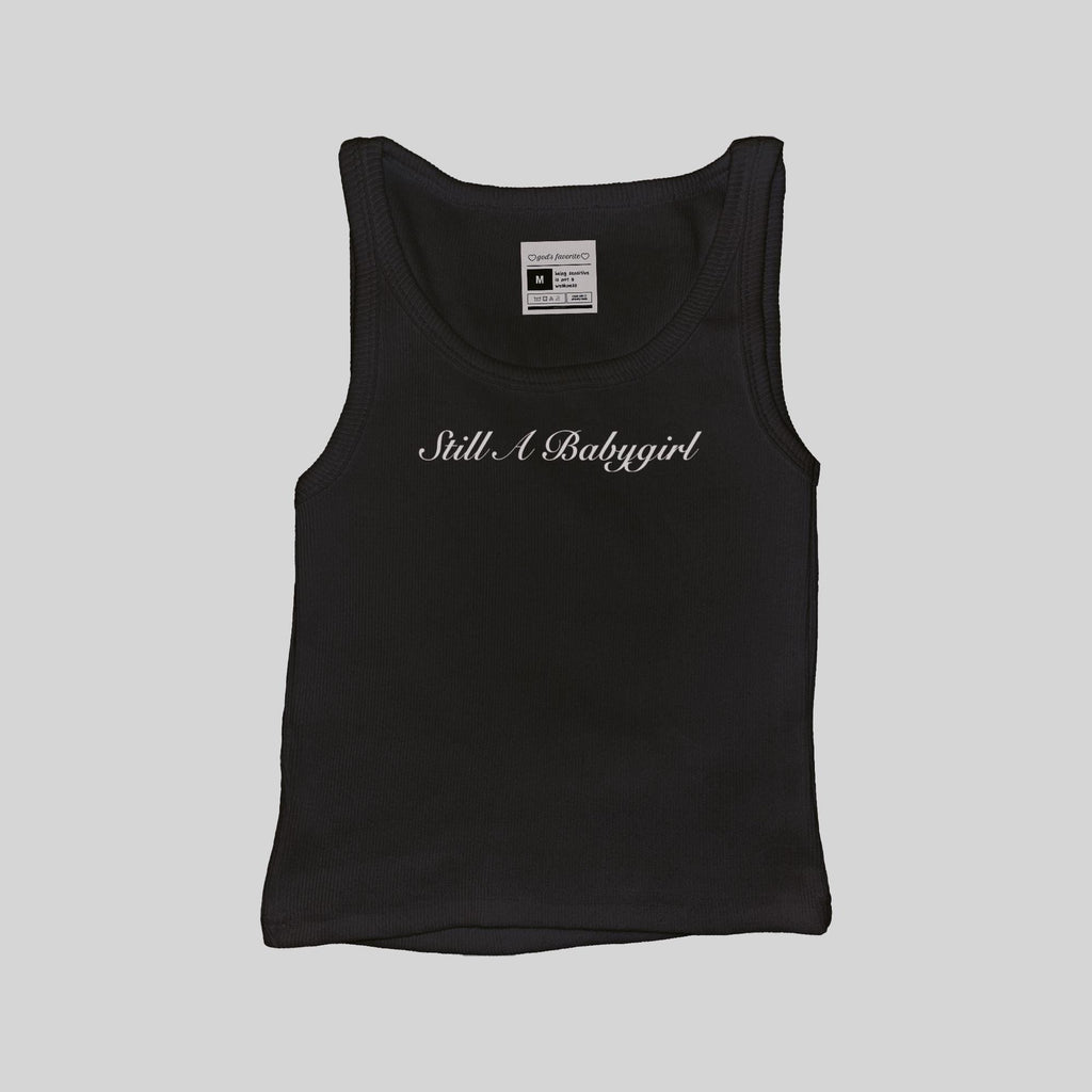 Black ribbed muscle tank top with 'Still A Babygirl' script on the chest