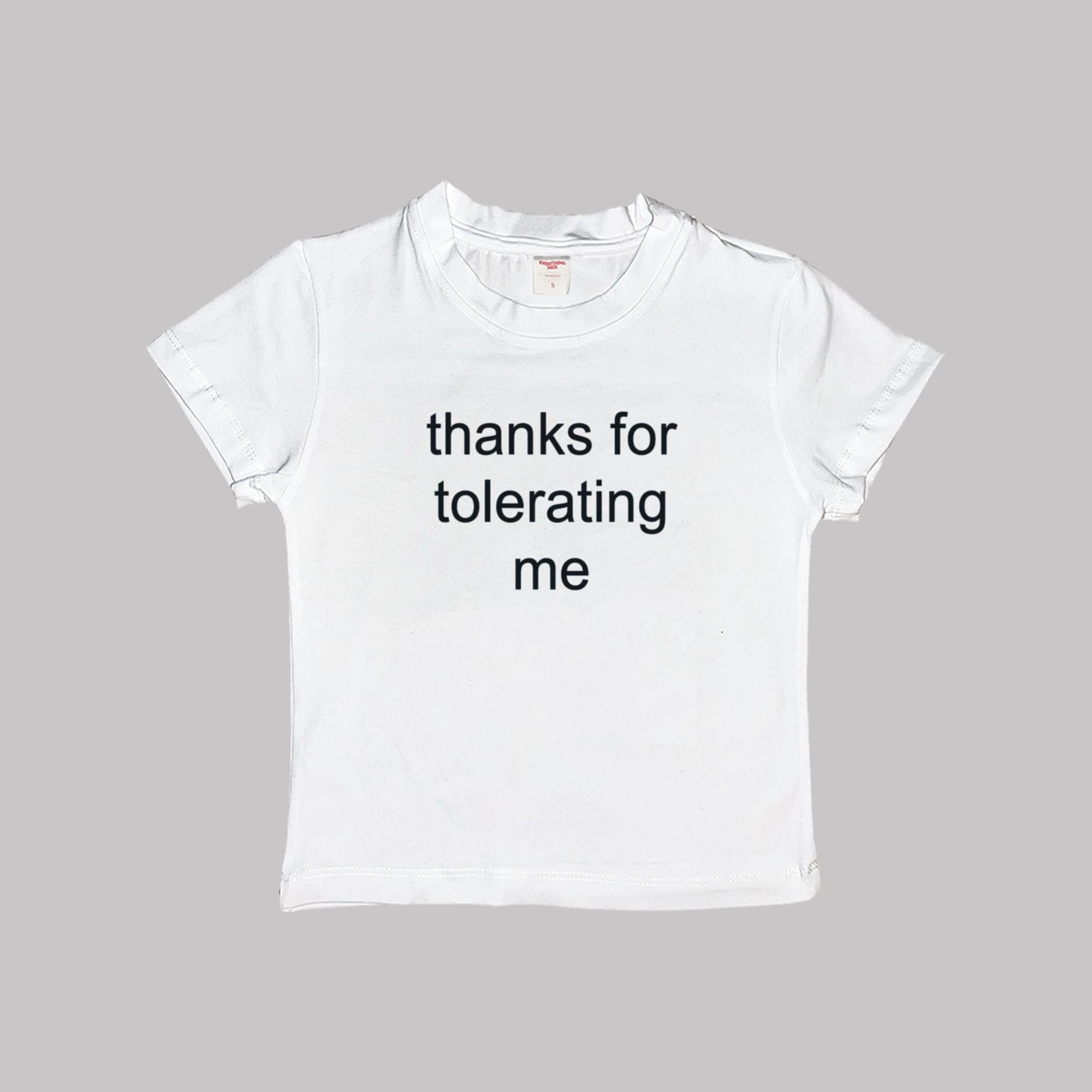 White cropped baby tee with 'thanks for tolerating me' text print