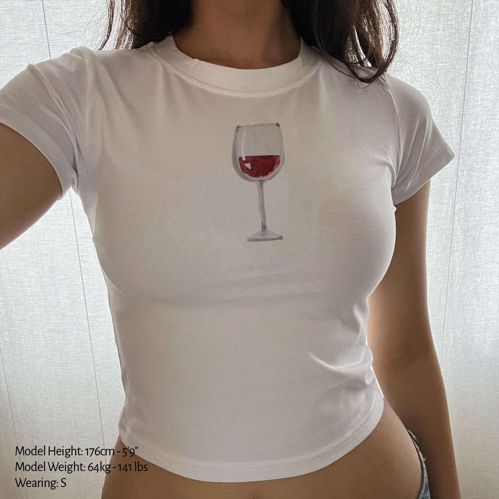 White baby tee crop top with small red wine glass graphic on chest