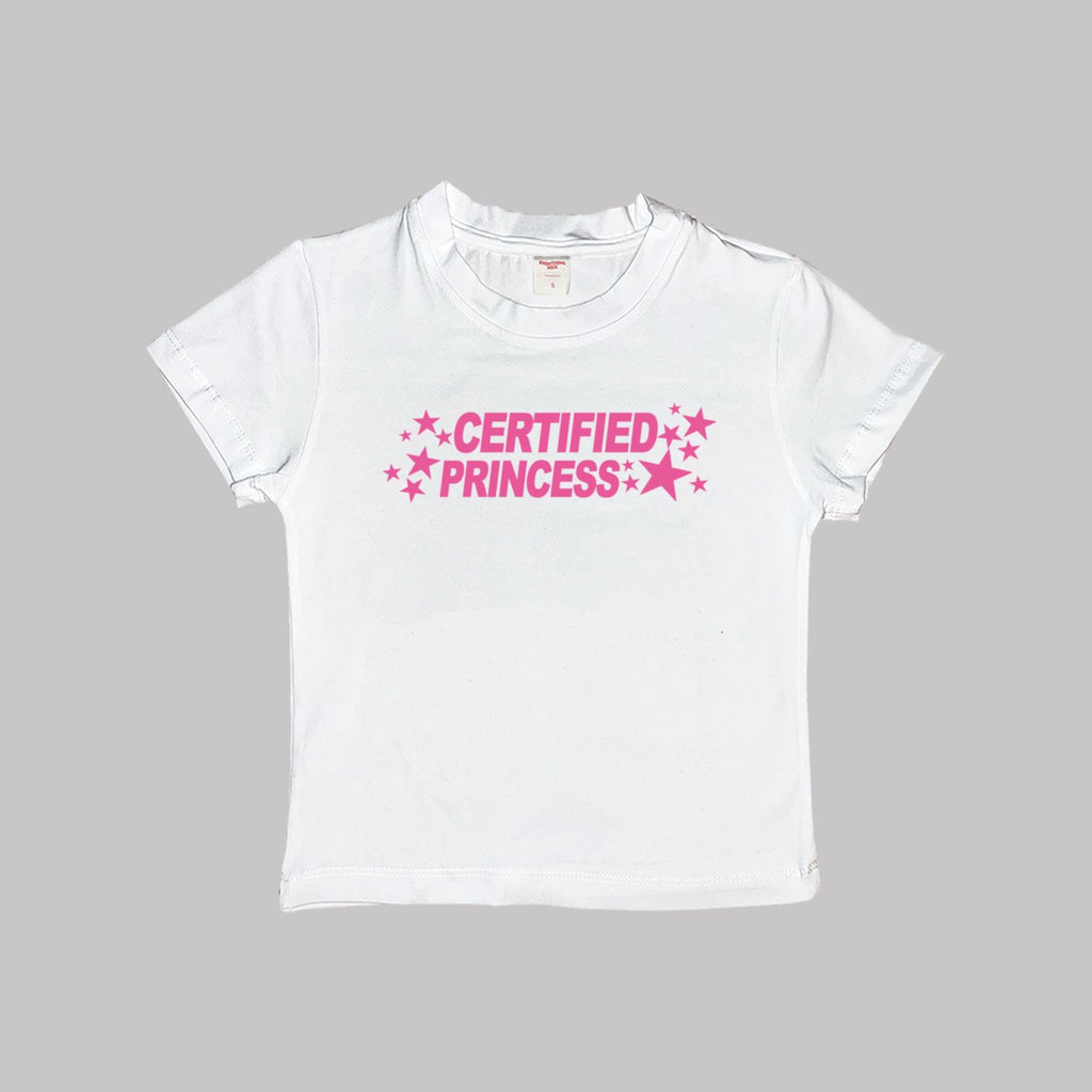 White short-sleeve crop baby tee with 'CERTIFIED PRINCESS' pink star text.