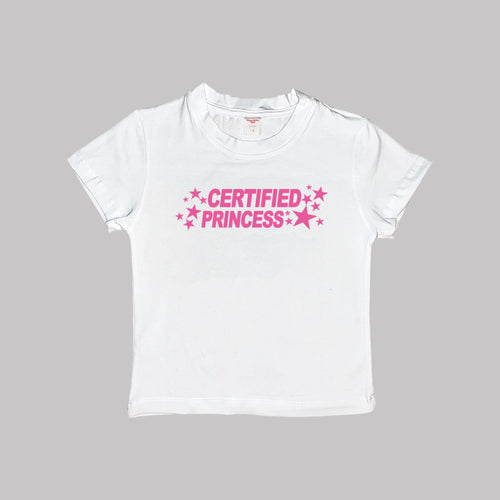 White short-sleeve crop baby tee with 'CERTIFIED PRINCESS' pink star text.