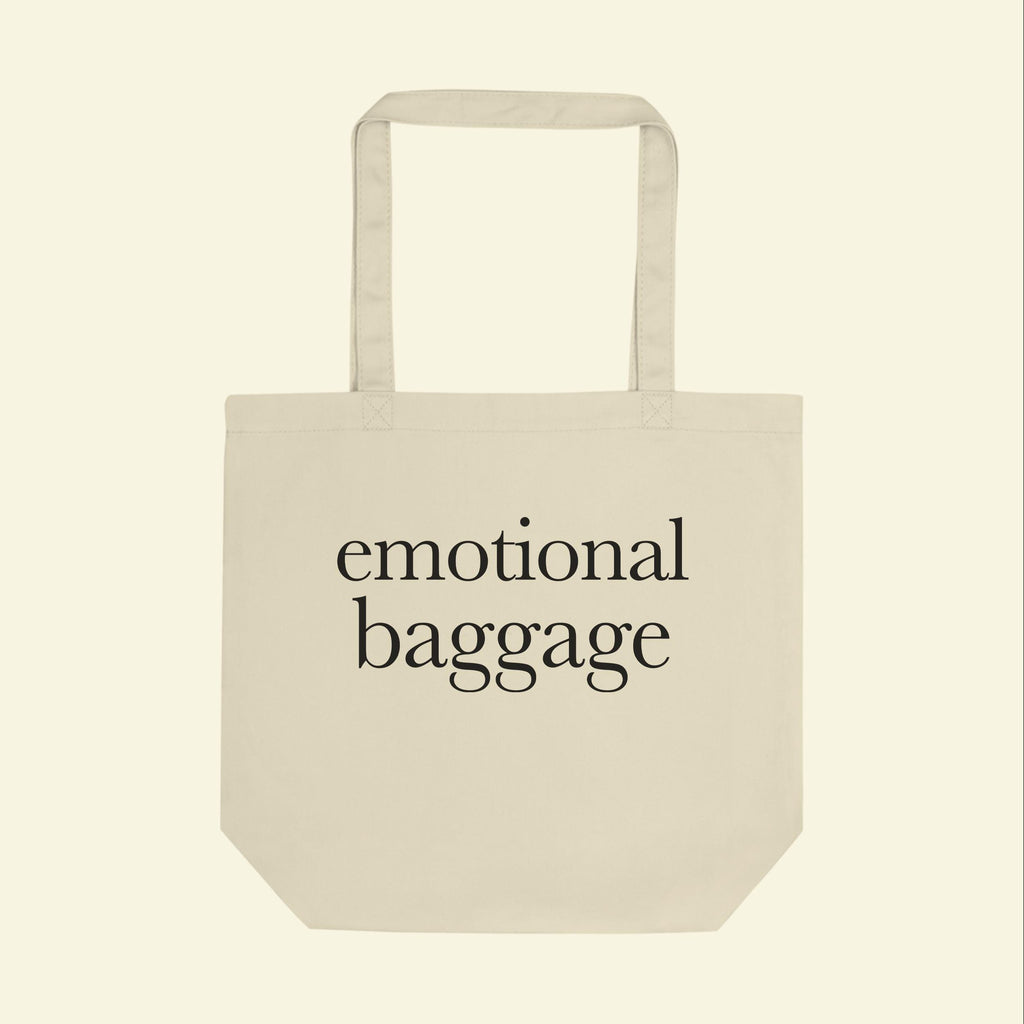 Beige tote bag with “emotional baggage” text on the front