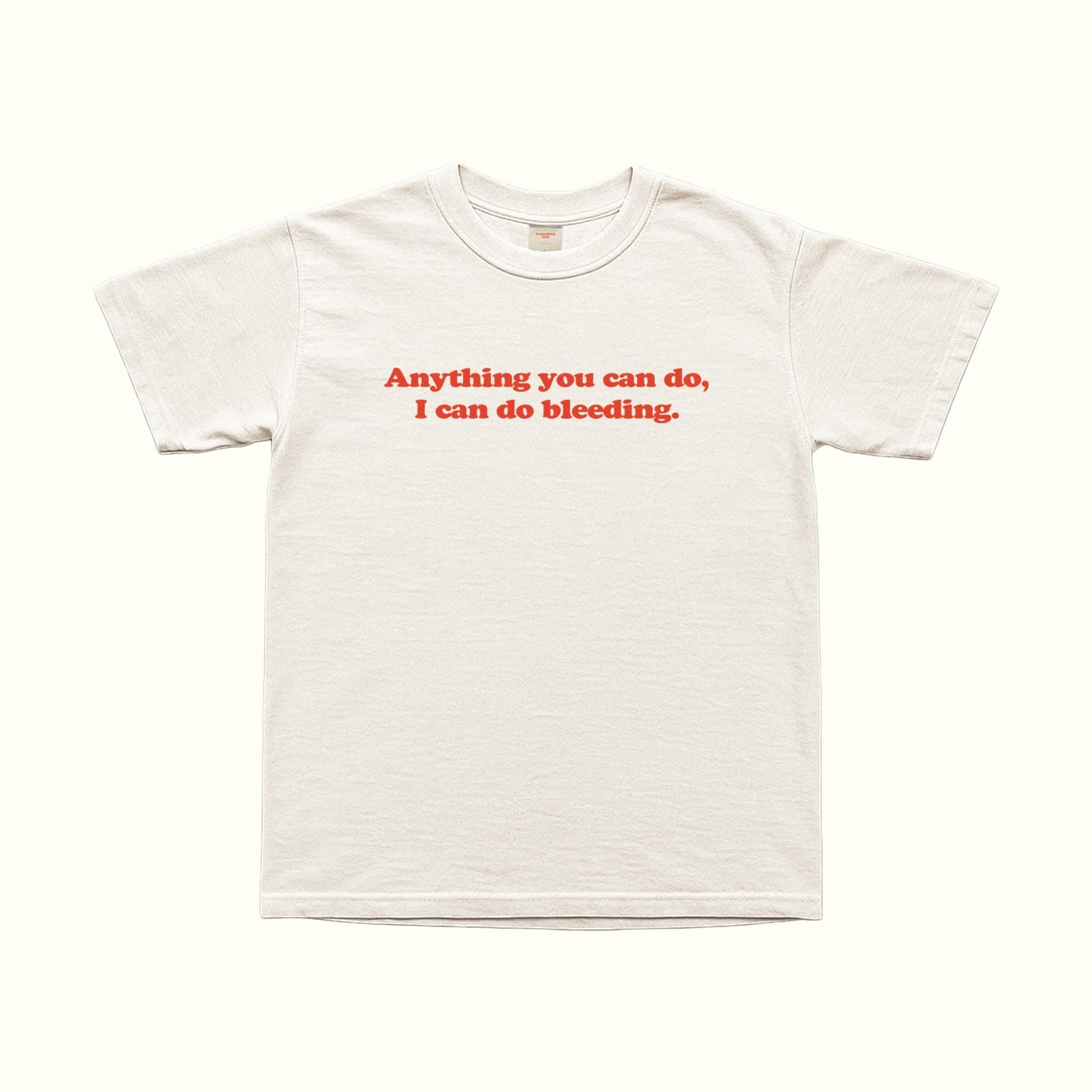White T-shirt with red “Anything you can do, I can do bleeding.” text on front