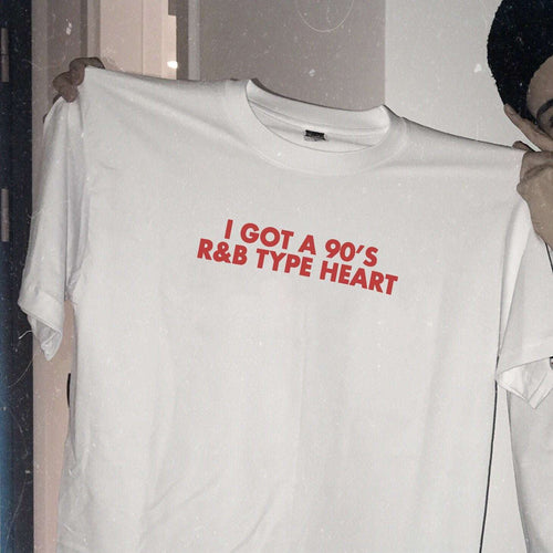White unisex t-shirt with red 'I GOT A 90's R&B TYPE HEART' print