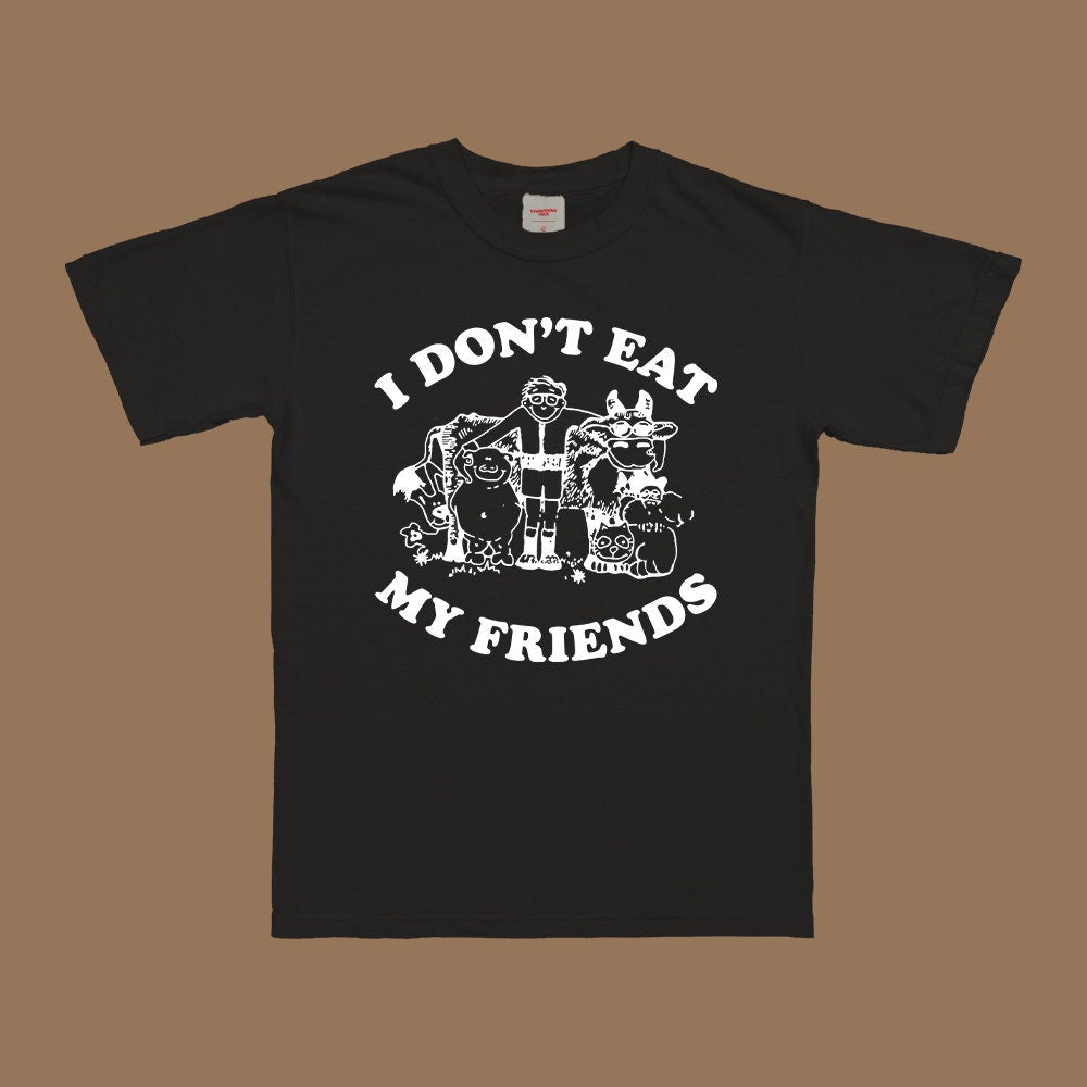 Schwarzes T‑Shirt mit Frontmotiv „I DON'T EAT MY FRIENDS“ und Tierfiguren